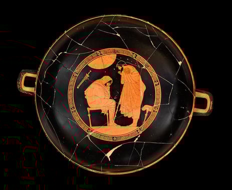 The interior of a red cup showing Achilles and Odysseus. 