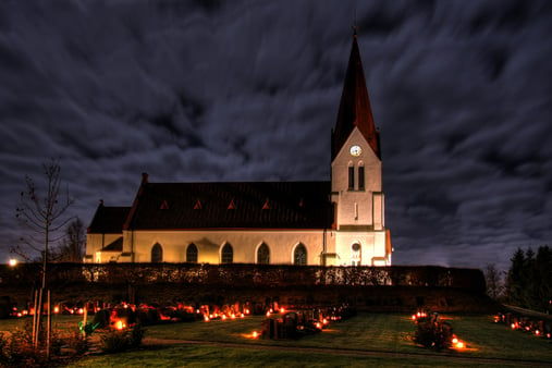 A cemetery outside an Evangelical Lutheran church (Church of Sweden) in Röke, Sweden on the feast of All Hallows.