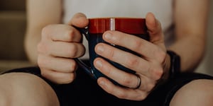 A man holding a mug.