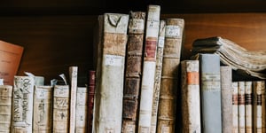 A shelve full of old books.