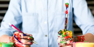 A man covered in paint.