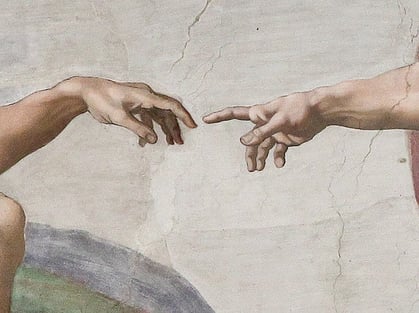 The "almost touching" hands detail from the Creation of Adam on the Sistine Chapel Ceiling by Michelangelo.