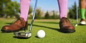 Man playing golf.