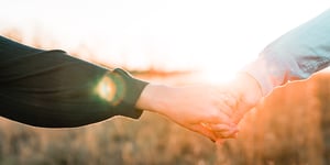 Two people holding hands.