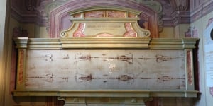 This is a faithful copy of the Holy Shroud of Turin it was made on colored photosensitive paper from official original negatives made by Guioseppe Enrie, applied to canvas and plasticized.