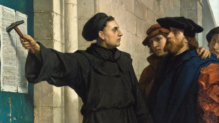 painting of Martin Luther nailing his 99 theses to the church door