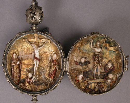 Rosary bead with the Crucifixion engraved.