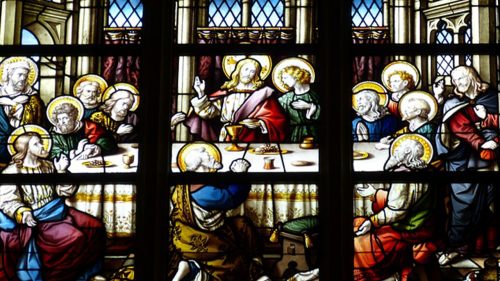 stained glass of eucharist at the last supper