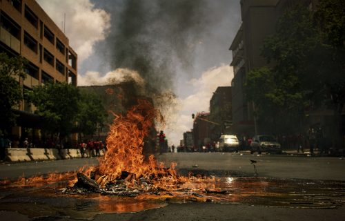 burning wreckage on empty city street