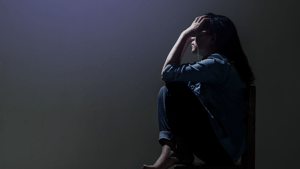 Woman suffering in darkness.