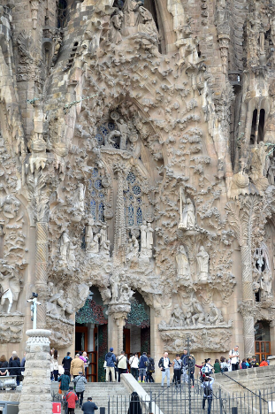 This grand doorway features sculptures influenced by many different historical styles, while remaining distinctively modern.