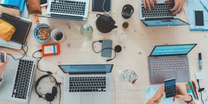 A table scattered with technology.