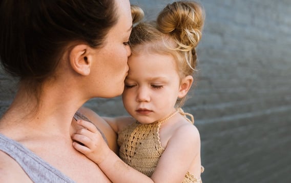 a mother showing her daughter the transcendental desire of perfect love with a hug.