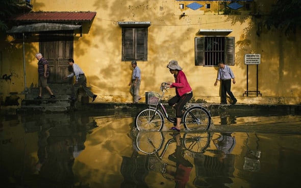 People living in flooded streets as an example of suffering caused by nature.